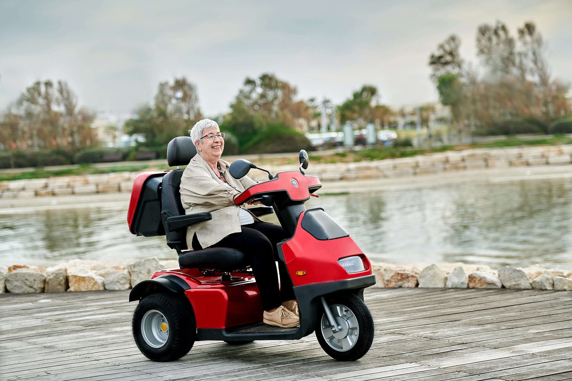 Afiscooter S3 Mobility Scooter - red with single seat outdoors