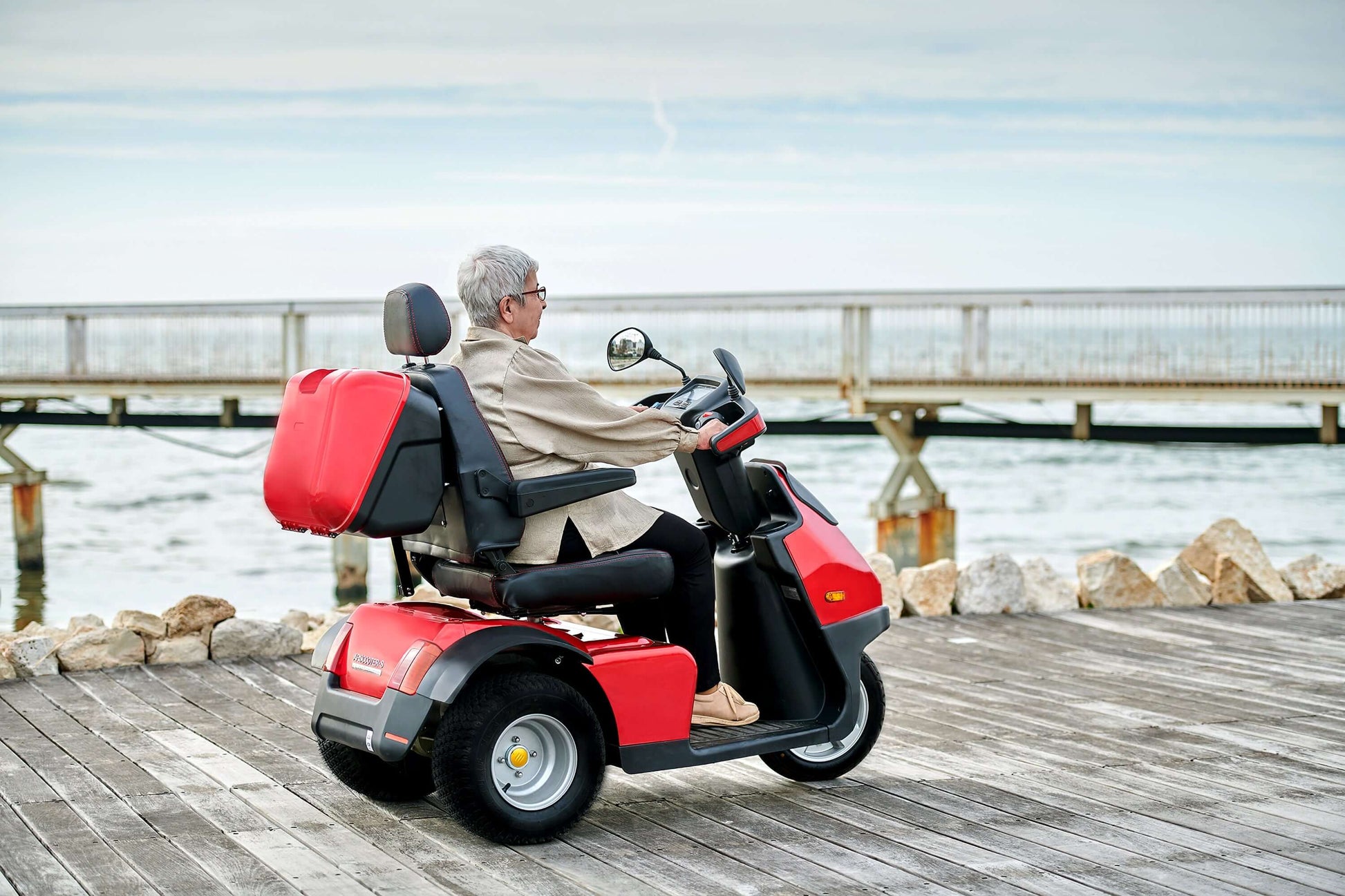 Afiscooter S3 Mobility Scooter - red with single seat outdoors ocean