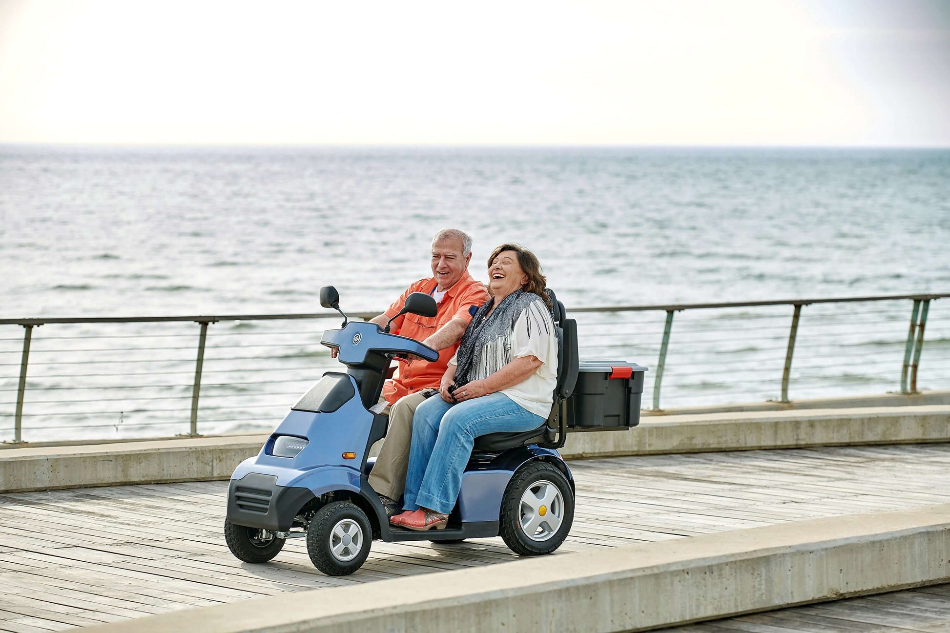 Afiscooter S4 Mobility Scooter - blue with two seats and two models outdoors