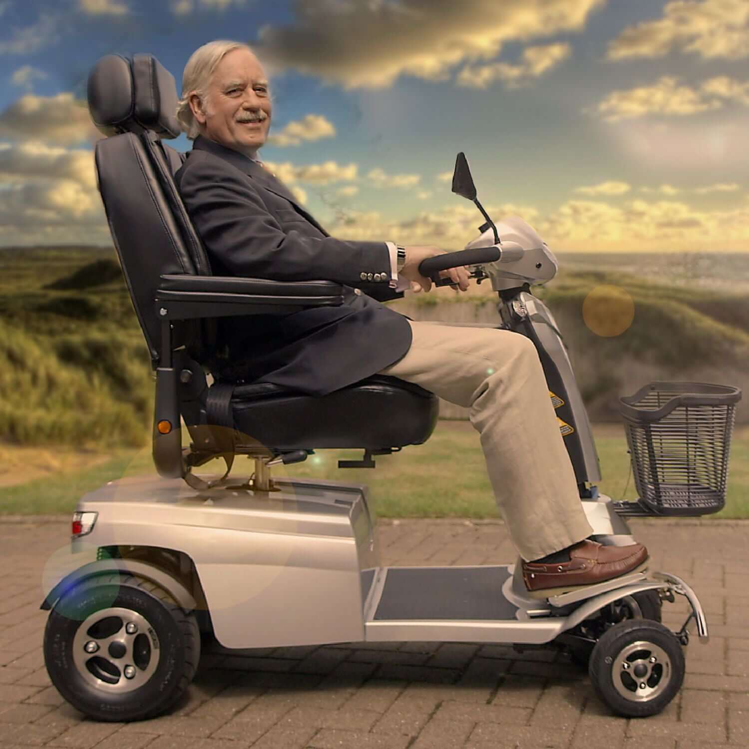 Quingo Toura 2 Mobility Scooter - right side outdoors with model